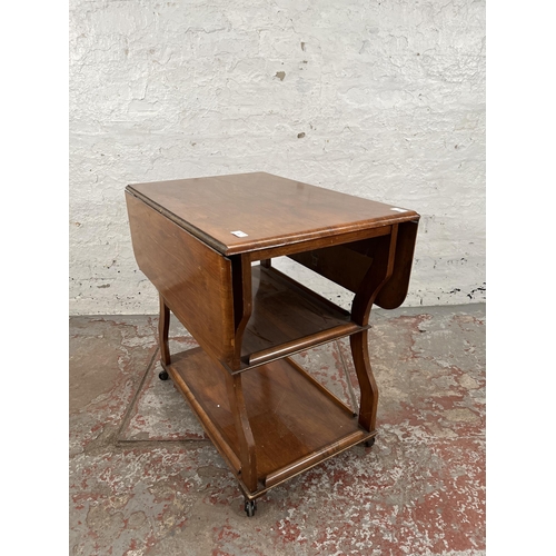 83 - A 1960s Tenax Manchester walnut drop leaf three tier tea trolley