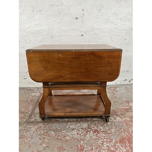 83 - A 1960s Tenax Manchester walnut drop leaf three tier tea trolley