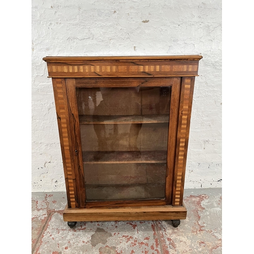 93 - A Victorian inlaid walnut and rosewood pier cabinet