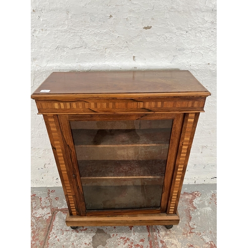 93 - A Victorian inlaid walnut and rosewood pier cabinet