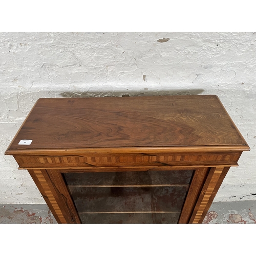 93 - A Victorian inlaid walnut and rosewood pier cabinet