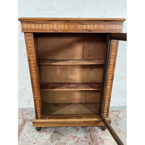 93 - A Victorian inlaid walnut and rosewood pier cabinet