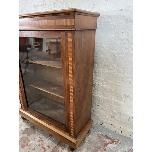 93 - A Victorian inlaid walnut and rosewood pier cabinet