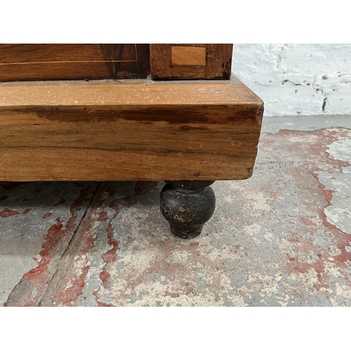 93 - A Victorian inlaid walnut and rosewood pier cabinet