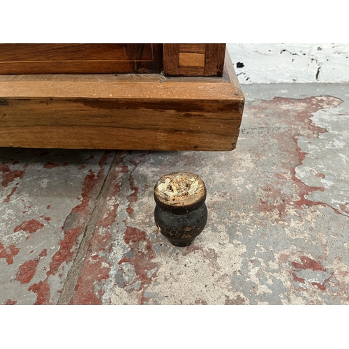 93 - A Victorian inlaid walnut and rosewood pier cabinet