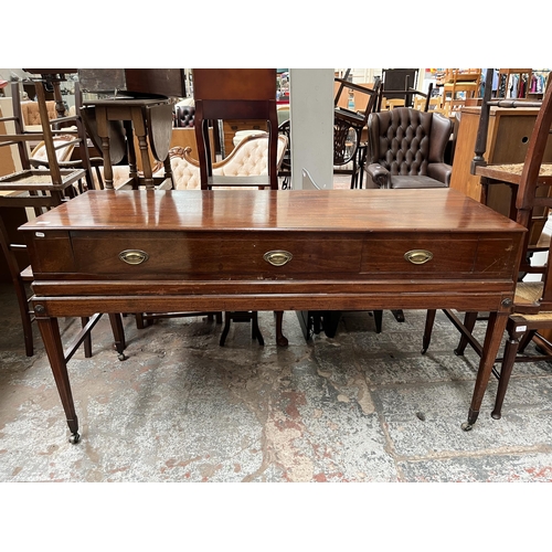 94 - A Regency inlaid mahogany sideboard with two drawers, tapered supports and castors