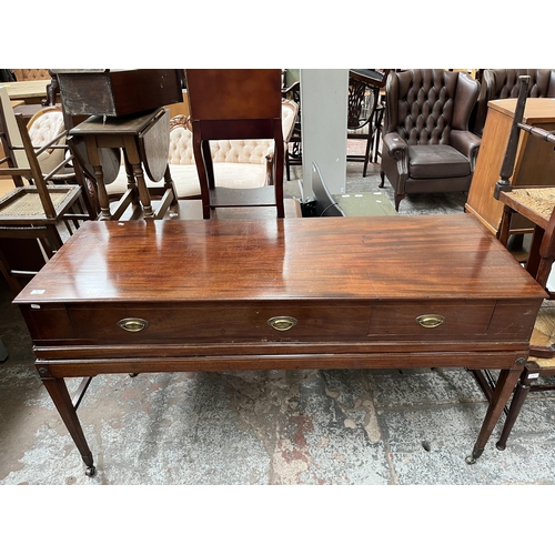 94 - A Regency inlaid mahogany sideboard with two drawers, tapered supports and castors