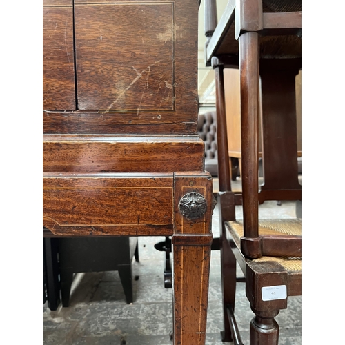 94 - A Regency inlaid mahogany sideboard with two drawers, tapered supports and castors