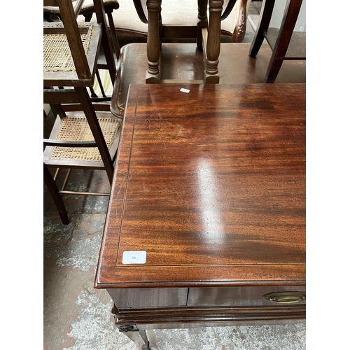 94 - A Regency inlaid mahogany sideboard with two drawers, tapered supports and castors