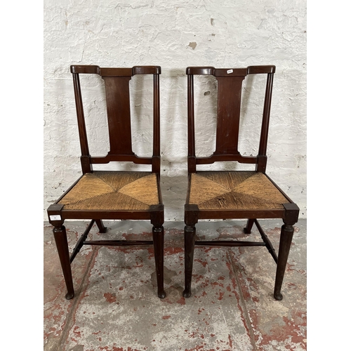 95 - A pair of Edwardian mahogany rush seated occasional chairs