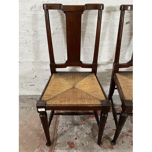 95 - A pair of Edwardian mahogany rush seated occasional chairs