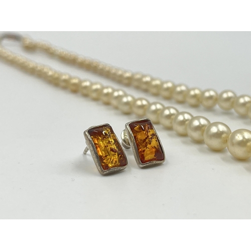 1180 - Two pieces of jewellery, one Ciro pearl necklace with 9ct gold clasp and one pair of .925 silver amb... 