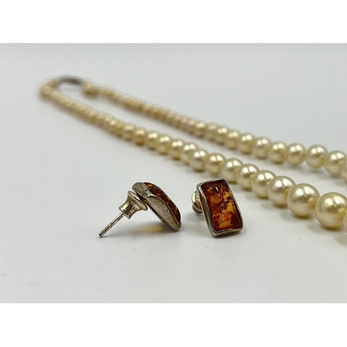 1180 - Two pieces of jewellery, one Ciro pearl necklace with 9ct gold clasp and one pair of .925 silver amb... 