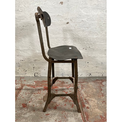 112B - A 1950s Tan Sad style metal and fibreboard industrial machinist's chair - approx. 88cm high