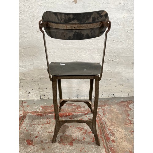 112B - A 1950s Tan Sad style metal and fibreboard industrial machinist's chair - approx. 88cm high