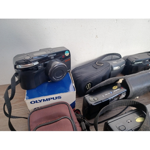 593 - A large collection of Olympus compact cameras to include µ[mju:] ZOOM 105, three AZ-300 Superzoom, A... 