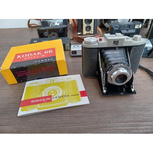 599 - Eleven Kodak cameras to include boxed 66 model II folding for 120 film with instruction manual, case... 