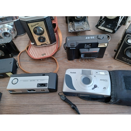 599 - Eleven Kodak cameras to include boxed 66 model II folding for 120 film with instruction manual, case... 