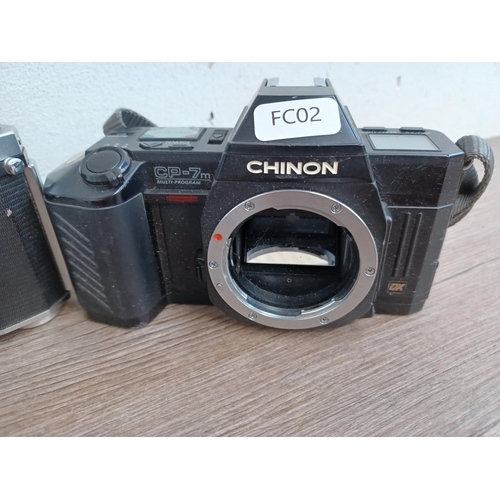 604 - Three 35mm SLR cameras, one cased Chinon CE-4 fitted with 1:1.7 50mm lens with instruction manual an... 