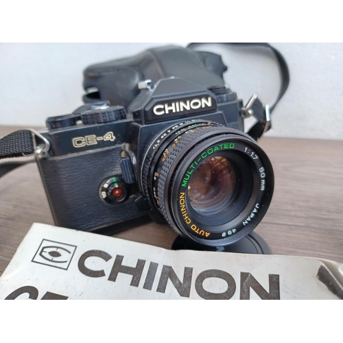 604 - Three 35mm SLR cameras, one cased Chinon CE-4 fitted with 1:1.7 50mm lens with instruction manual an... 