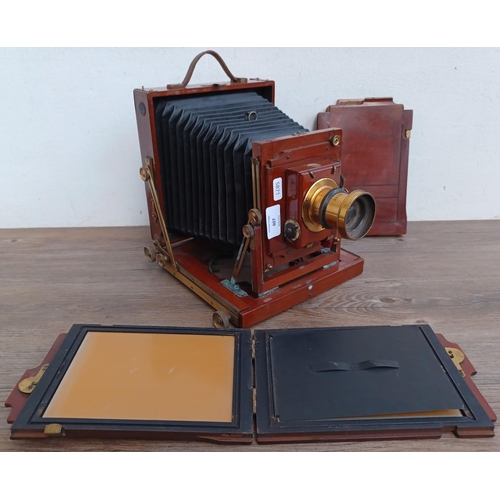 607 - An antique W. Butcher & Sons Ltd. wood and brass folding field camera