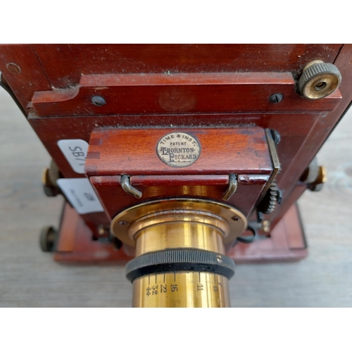 607 - An antique W. Butcher & Sons Ltd. wood and brass folding field camera