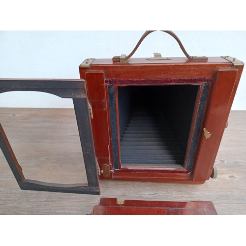 607 - An antique W. Butcher & Sons Ltd. wood and brass folding field camera