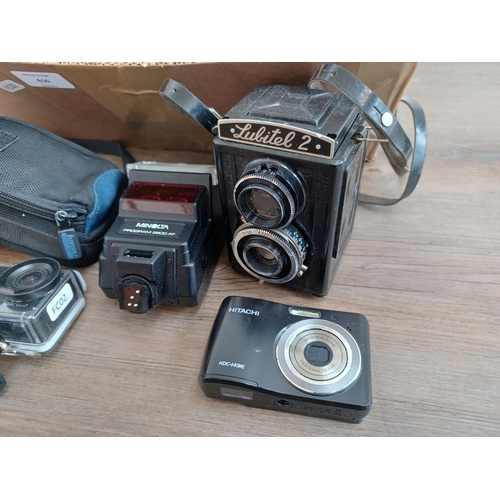 610 - A collection of cameras and accessories to include Lubitel 2 TLR, waterproof cased Crosstour 4K wi-f... 