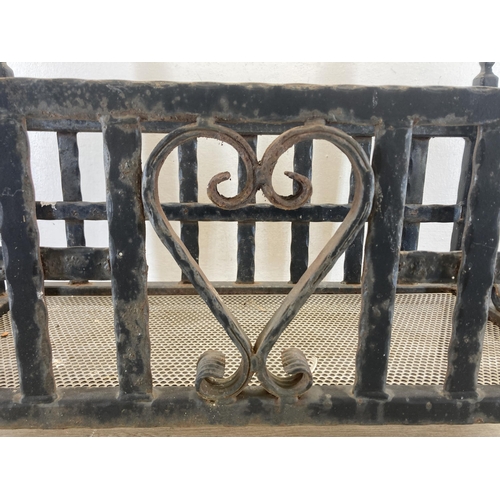 328 - A cast and wrought iron rectangular fire grate/planter with heart design - approx. 48cm high x 66cm ... 