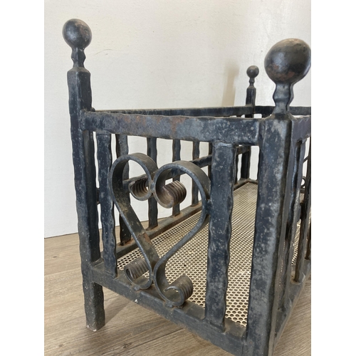 328 - A cast and wrought iron rectangular fire grate/planter with heart design - approx. 48cm high x 66cm ... 