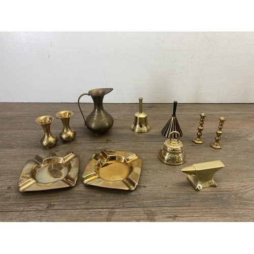 331 - A collection of brassware to include Berry & Warmington Ltd. cast iron weighing scales with brass pa... 