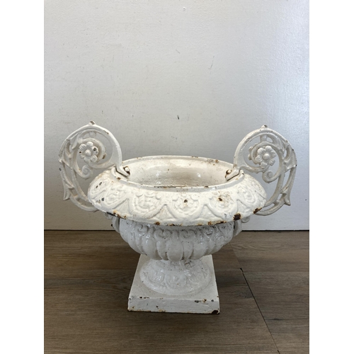 335 - A pair of Victorian white painted cast and wrought iron twin handled urn planters - approx. 31cm hig... 