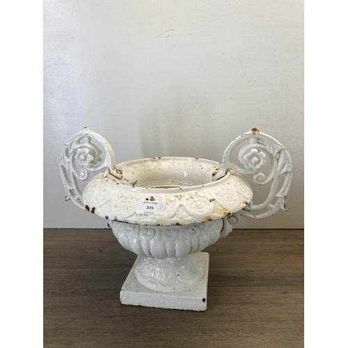 335 - A pair of Victorian white painted cast and wrought iron twin handled urn planters - approx. 31cm hig... 