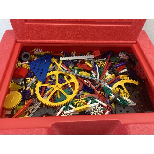 364 - A K'Nex red plastic carrycase containing K'nex