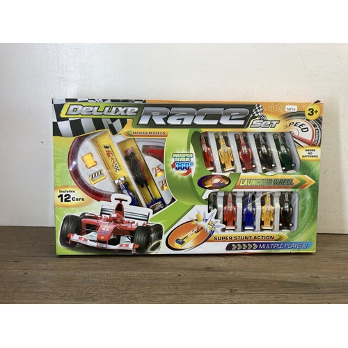 367 - A collection of model vehicles to include Deluxe Race set, Disney Cars etc.