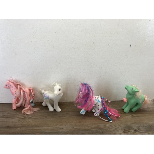 371 - A collection of 1990s Polly Pocket miniature play sets together with four My Little Pony figurines