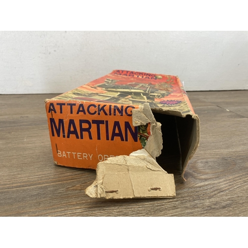 381 - A 1960s boxed Horikowa S.H Japan battery operated tin plate Attacking Martian robot