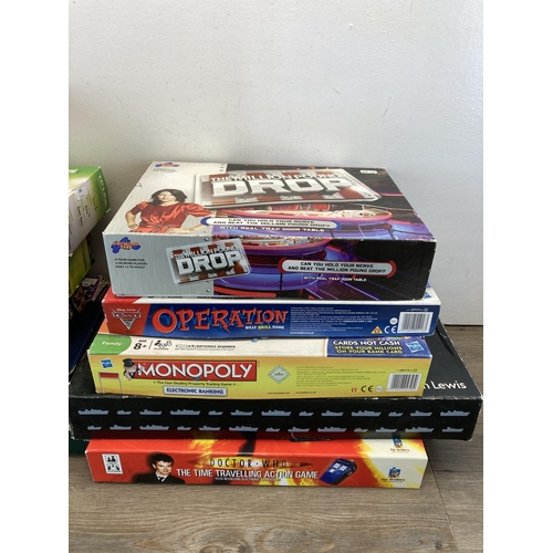 395 - A collection of board games to include Disney Cars 2 Operation, Monopoly etc.