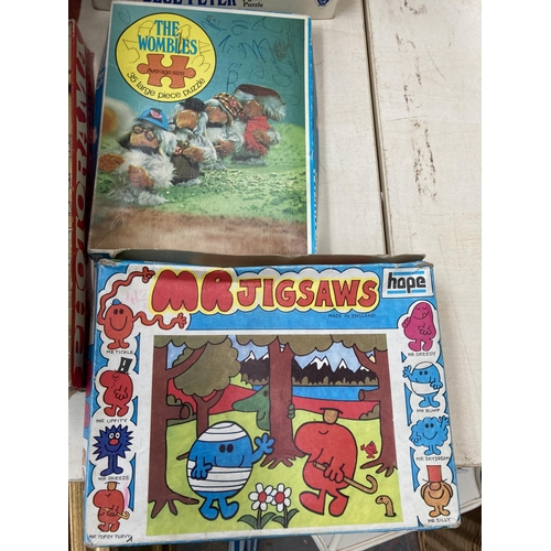 396 - A large collection of vintage games, toys and magazines to include Fisher-Price Little Snoopy, Boy's... 