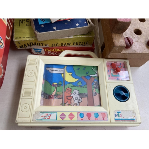 396 - A large collection of vintage games, toys and magazines to include Fisher-Price Little Snoopy, Boy's... 