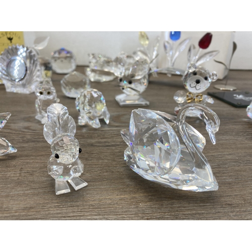 290 - A collection of crystal figurines and ornaments to include Waterford Crystal quartz mantel clock, Sw... 