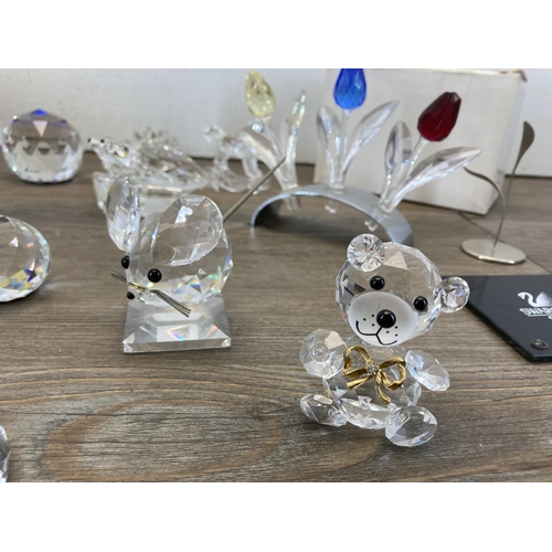 290 - A collection of crystal figurines and ornaments to include Waterford Crystal quartz mantel clock, Sw... 