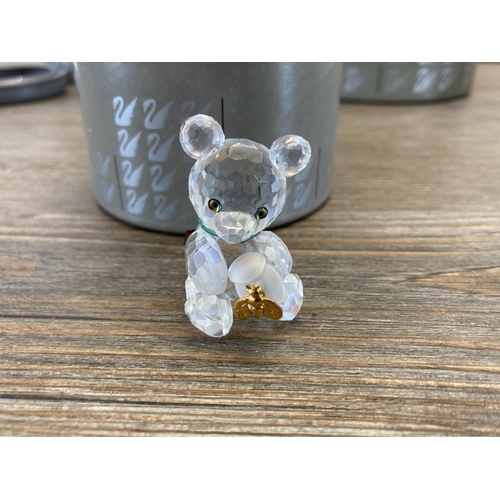 303 - Four boxed Swarovski Crystal bear figurines to include Kris Bear with Skis model no. 234710, Kris Be... 