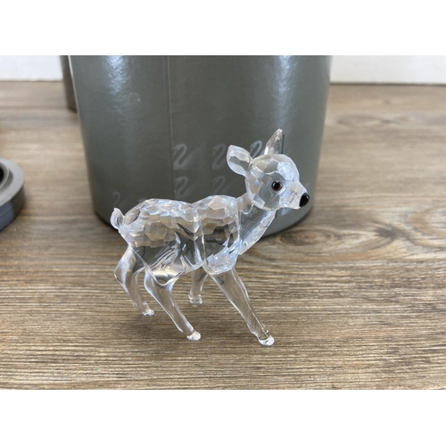 304 - Three boxed Swarovski Crystal Deer figurines, Fawn model no. 235045, Reindeer model no. 214821 and D... 