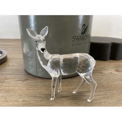 304 - Three boxed Swarovski Crystal Deer figurines, Fawn model no. 235045, Reindeer model no. 214821 and D... 