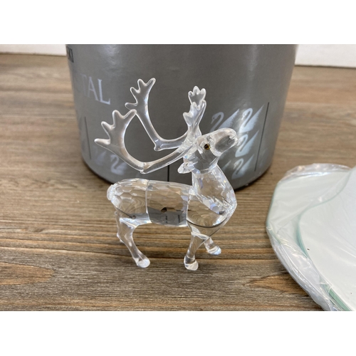 304 - Three boxed Swarovski Crystal Deer figurines, Fawn model no. 235045, Reindeer model no. 214821 and D... 