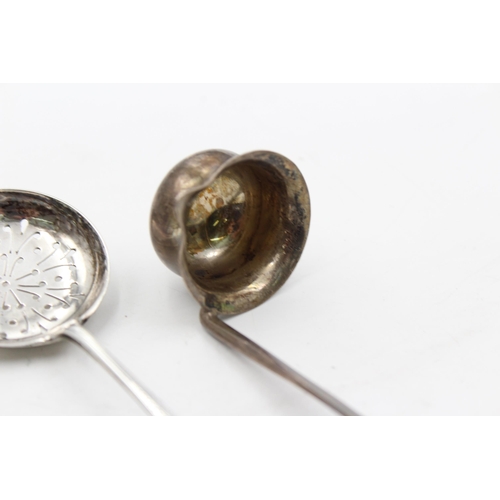 1293 - Three pieces of hallmarked sterling silver, one sugar sifter and two ladles - approx. gross weight 7... 