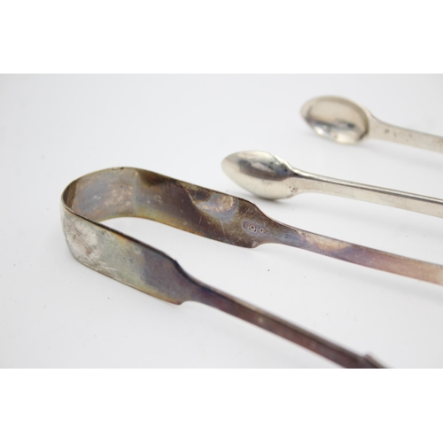 1296 - Two pairs of Georgian hallmarked sterling silver sugar tongs - approx. gross weight 91 grams