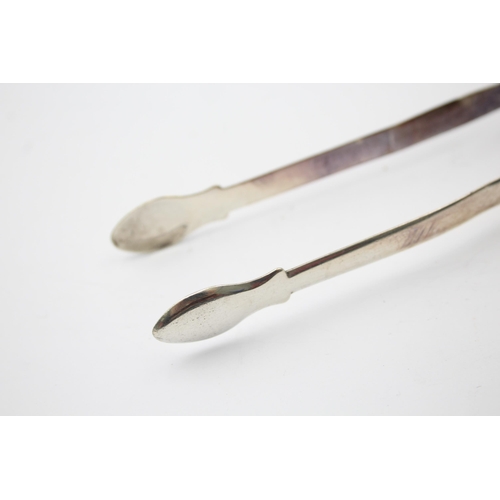 1303 - Two pairs of Georgian hallmarked sterling silver sugar tongs - approx. gross weight 66 grams