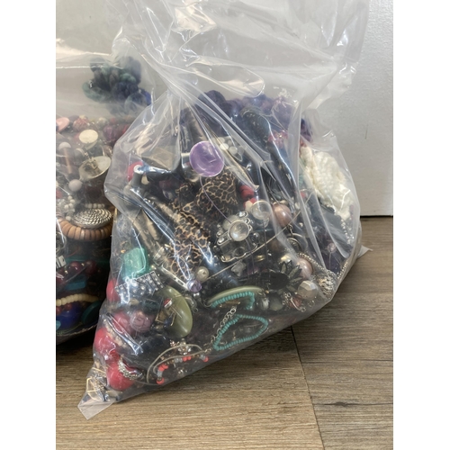 415 - Four bags containing a large quantity of costume jewellery